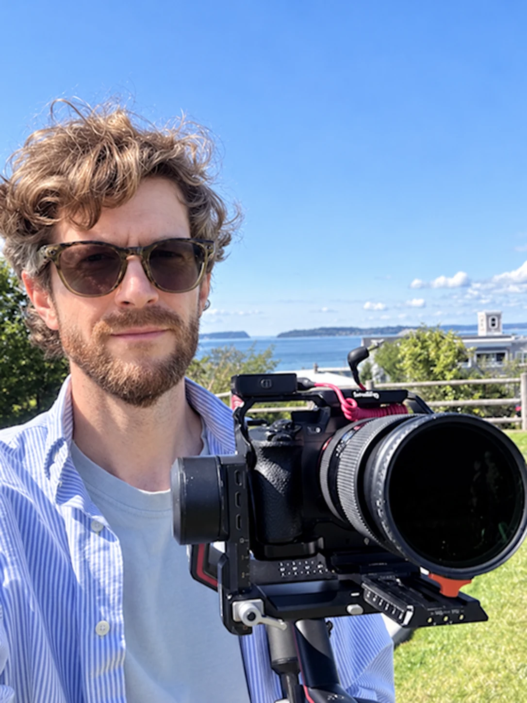 Andrew Isak with his video camera — retouched portrait